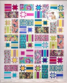 a colorful quilt with many different designs on the front and back, along with an image of a dog