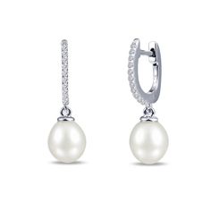 Simply beautiful. These huggie drop cultured freshwater pearl earrings dangle from the lustrous sterling silver bonded with platinum and accented with Lafonn's signature Lassaire simulated diamonds. CTW: 0.22 STONE COUNT: 22 CENTER STONE: N/A DIMENSION: N/A LENGTH: N/A Formal Huggie Pearl Earrings, Classic Silver Huggie Pearl Earrings, Elegant White Gold Huggie Pearl Earrings, Freshwater Pearl Drop Earrings, Simulated Diamond Rings, Freshwater Pearl Earrings, Dangle Hoop Earrings, Halo Earrings, Freshwater Pearls Earrings