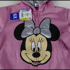 Minnie Mouse Hoodie Full Zip Hoodie Attached Hood W “Ears” Sparkly Thread Woven Throughout Ribbed Cuffs/Hem Large Minnie Graphics On Front Silver Material Hood Lining Front Hand Pockets Brand New With Tags Pricing Is Fair And Quite Firm . Please Let Us Know If You Have Any Questions. Mickey Mouse Hooded Tops For Winter, Cute Winter Mickey Mouse Sweatshirt, Cute Mickey Mouse Winter Sweatshirt, Winter Mickey Mouse Hooded Top, Cute Hooded Mickey Mouse Top, Cute Mickey Mouse Hoodie For Winter, Cute Mickey Mouse Hoodie, Cute Long Sleeve Mickey Mouse Hoodie, Disney Winter Hooded Tops