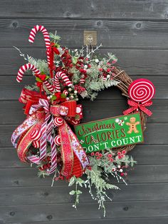 a christmas wreath with candy canes and decorations