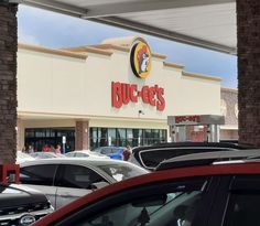 cars are parked in front of a burger king's