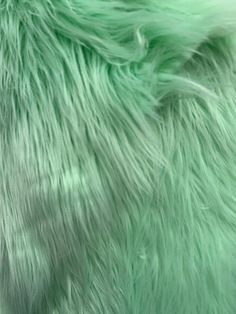 the fur is very soft and bright green