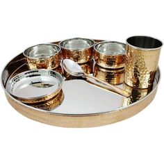 a metal tray with cups and spoons on it