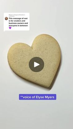 a heart - shaped cookie with the words voice of elye myerss on it