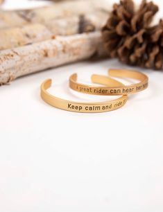 "Engravings - \"Keep calm and ride on\" & \" A great rider can hear her horse whisper\" For all horse lovers out there. This is a definite must have to show how much you love horses or give as a gift to an equestrian lover. For now, this bracelet is only available in aluminum metal in the gold matte color. I will be offering more varieties of chain lengths and plating colors as I grow. The bracelet measures 7\" long and is flexible. More about me: I learned how to hand stamp jewelry and have cre Equestrian Bracelet, Cowgirl Bracelets, Black Leather Cuff Bracelet, Aluminum Bracelets, Horse Bracelet, Ride On, Lovers Bracelet, Animal Bracelet, Equestrian Gifts