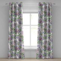 an open window with floral curtains in front of it and a white wall behind the window