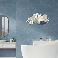 a bathroom with a sink, mirror and bathtub next to a wall mounted sculpture