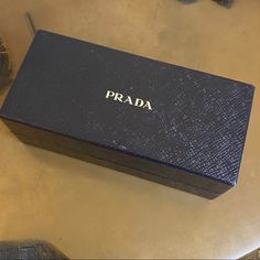 Prada New Sunglasses Case Black Gift Box Large Os One Size Prada, New. 100% Authentic. Prada Sunglasses Gift Box Metallic Silver Foil Logo Glossy Rich Black Textured Lizard Alligator Snake Finish! Lined In Prada Semi-Gloss Signature Lining Inner Lining Is Matched & Continues Up The Sides! Measures: 6 5/8” X 2 7/8” X 2 3/8” Works With Both Sunglasses & Glasses. Large Enough To Fit My Prada Sport Shield Type! Perfect New Condition! Will Be Wrapped & Boxed To Protect In Shipping. Prada Sunnies, Leather Packaging, Prada Accessories, Sustainable Leather, New Sunglasses, Prada Sunglasses, Black Gift Boxes, Black Textures, Sunglasses & Glasses