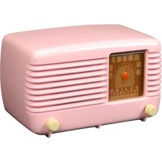 an old fashioned pink radio on a white background