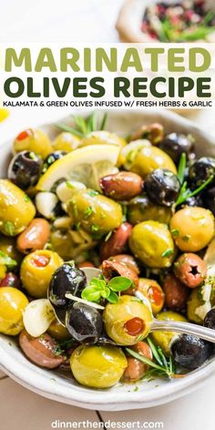 a white bowl filled with olives and herbs