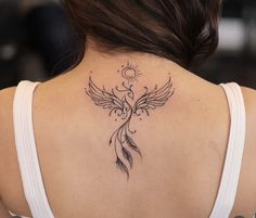 a woman with a tattoo on her back