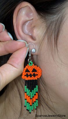 "Stylish earrings for Halloween, Seed bead pumpkin earrings These pumpkin earrings for Halloween are specially made for you to emphasize your style for the holiday. They emphasize your style and help you stand out from everyone else. This earrings is made from the high-quality Czech bead, with the use of sterling silver furnice, with a bright pumkin pattern. This pumpkin earrings can carry every girls and woman of any age, harmonizes with any clothes. Earrings details: Length: Dangle earrings me Beaded Dangle Earrings For Halloween, Dangle Beaded Earrings For Halloween, Halloween Beaded Dangle Earrings Gift, Halloween Gift Beaded Dangle Earrings, Adjustable Beaded Earrings For Halloween, Beaded Pumpkin Earrings, Halloween Seed Bead, Bead Pumpkin, Beaded Pumpkin