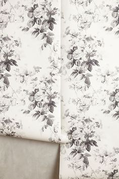 a white and black floral print curtain with matching valance