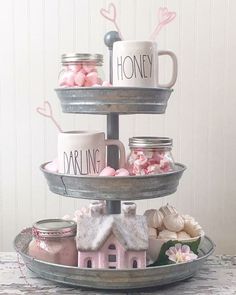 three tiered tray with cups and mugs on it that says,'i love you