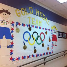 this is an image of a school hallway decorated with olympic symbols and medals on the wall