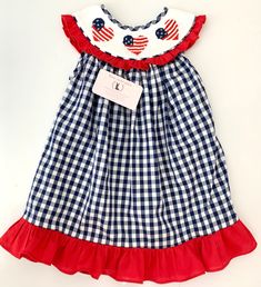 Independence Day Smocked Dress, Fourth of July Dress This adorable smocked dress is perfect for this upcoming Independence Day. . This patriotic smocked dress is absolutely superb for your little ones for celebrating July 4th with families. They come in 5 different size (12M - 5T) and please make sure to check the size chart. Washing Care Instructions Most items can be washed safely in cold water on delicate cycle and hung to dry. If the item that you are ordering has red or another bright color Cotton Gingham Smocked Dress With Ruffles, Cotton Smocked Dress With Ruffles In Gingham, Summer Gingham Dress With Smocked Cuffs, Cotton Gingham Dress With Smocked Bodice, Fitted Gingham Smocked Dress With Smocked Cuffs, Embroidered Smocked Summer Dress For Daywear, Cotton Smocked Lined Dress For Daywear, Cotton Smocked Dress Lined For Daywear, Gingham Cotton Dresses With Smocked Cuffs