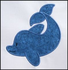 a blue whale embroidered onto a white shirt