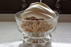 a glass bowl filled with food on top of a counter