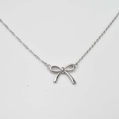 Add a touch of elegance and sparkle to any outfit with our Sweet Diamond Bow Ribbon Necklace. Adorned with delicate diamond and crafted in sterling silver, this bow-shaped necklace is 16 inches long with a 2 inch extender. Perfect for special occasions or everyday wear! Pretty Jewelry Necklaces, Ribbon Jewelry, 16 Inch Necklace, Diamond Bows, Gold Vermeil Jewelry, Ribbon Necklace, Bow Necklace, Bow Ribbon, Bow Jewelry