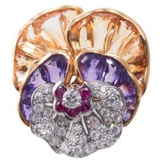 Iconic Oscar Heyman platinum and 18k gold pansy flower brooch, set with amethyst, citrine, rubies and approx. 1.25ctw G/VS diamonds. The brooch measures 1.25" x 1 1/8". Hallmarked with serial No. 200440, and OH marks, along with plat. and gold assay marks. . Total weight: 14.2 grams. Beautiful Baubles, Pansy Flower, Bold Rings, Pansies Flowers, Harry Winston, Diamond Brooch, Vs Diamond, Pearl Brooch, Fabulous Jewelry