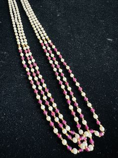 Pink hydro beads n pearls mala/3 lines mala/18" pink n pearls mala. ** P.S: non returnable product. Please ask any question if you have related to this product before purchasing as returns for size, Color,weight etc are not covered. Buyer is responsible for return shipping cost. Pink Round Pearl Beads, Pink Pearl Chain Beaded Necklaces With Round Beads, Pink Pearl Chain Beaded Necklace With Round Beads, Festival Pearl Drop Necklace With Round Beads, Pink Pearl Chain Necklace With Round Beads, Festival Pearl Necklace With Round Beads, Elegant Pink Pearl Necklace For Festivals, Pink Pearl Drop Beaded Necklaces With Round Beads, Pearl Chain Necklace With Round Beads For Festivals