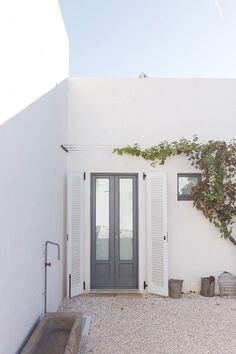 a white building with a door and window