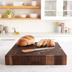 a loaf of bread sitting on top of a cutting board