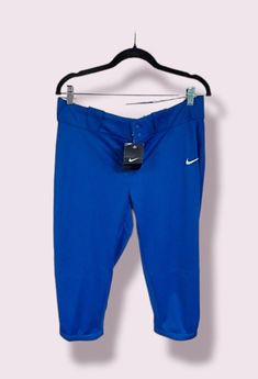 the nike capri pants are hanging on a hanger