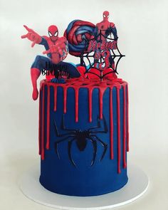 a spiderman cake with red and blue icing