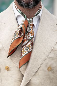 This floral pattern with hand-rolled hems will give your look an elegant twist. This scarf is a testament to timeless craftsmanship, a blend of care, and passion. The classic neckerchief size: Approx. 27" x 27". A comfortably large size that fits most men, unlike smaller bandanas. 100% silk twill: A soft, silky fabric traditionally used in men's tailoring for its look and its drape. Characterized by a diagonal weave which makes it very durable. Hand rolled hems: For the ultimate in luxury and so Elegant Mens Fashion, Orchestra Photoshoot, Mens Scarf Fashion, Man Scarf, Scarves Men, Badass Beard, Americana Tattoo, Men Scarf, Dapper Mens Fashion