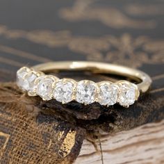 Modeled after antique diamond bands from the Georgian and Victorian eras, this band is set with chunky and charming old mine cut diamonds in 18kt Yellow Gold! The diamonds are bright and sparkly and just looks so beautiful and elegant on the finger. 18kt Yellow Gold Size 5, and fully sizable Measures: 2.53mm H & 18.83mm W Diamonds are natural and Earth-mined, approx. G/H colors, VS/SI clarities Timeless Cushion Cut Diamond Ring With Rose Cut Diamonds, Cushion Cut Rose Cut Diamond Jewelry, Heirloom Cushion Cut Diamond Ring With Single Cut Diamonds, Wedding Diamond Ring With Rose Cut Cushion Shape, Heirloom Baguette Cut Diamond Ring With Rose Cut Diamonds, Heirloom Baguette Cut Rose Cut Diamond Ring, Heirloom Rose Cut Baguette Diamond Ring, Heirloom Cushion Cut Single Diamonds Wedding Ring, Heirloom Cushion-cut Single Diamond Wedding Ring