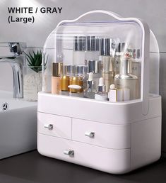 a white vanity with many different types of cosmetics on it and the words white / gray large