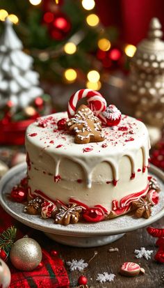 a christmas cake with white frosting and candy canes