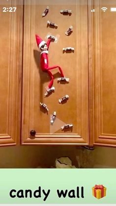 the elf is stuck to the wall in the kitchen with magnets on it's back