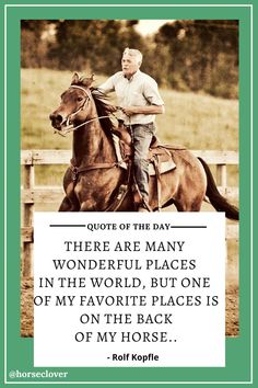 a man riding on the back of a brown horse next to a wooden fence with a sign