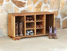 two pairs of shoes are sitting next to a wooden shoe rack with multiple compartments on each side