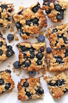 blueberry crumb bars cut into squares on a plate