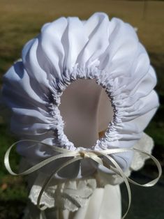 Please read shop announcement! Please read my shop announcement! This beautiful french Machine sewn bonnet is made using white Imperial poly/cotton batiste fabric, Swiss Embroidered Lace and French Valenciennes lace. Delicate ivory lace decorates the bonnet. The back of the bonnet is adjustable with double-face satin ribbon. Satin ribbon closes the neck under the chin. The bonnet can also be made using other fabric colors. See picture for available colors. You can select another color during che White Fitted Bonnet For Baptism, Fitted White Bonnet For Baptism, Adjustable Cream Bonnet For Baptism, Adjustable Cream Bonnet As A Gift, Adjustable Cream Bonnet As Gift, White Adjustable Hat For Baptism, White Bonnet Gift, One Size Fits Most, White Bonnet, One Size Fits Most, Gift, White Bonnet Gift (one Size Fits Most)