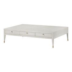 a white coffee table with two drawers on each side and one drawer at the top