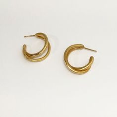 Designer Notes + This hand made unisex double hoop is like a you're wearing a multiple hoop but no extra piercing required. A beautiful classic piece for everyday and anywhere. DETAILS + Material: Gold: 18K yellow gold plated brass, a thick layer electroplating for durability. Silver: high polished sterling silver. Earring Posts: 18K gold plated sterling silver posts. Measurements: 7/8" in length (2.3cm) 1" in width (2.5cm) Handcrafted by artisans in New York City. • Care: Keep airtight to maint Double Hoop Earrings, Earring Posts, Silver Earring, Silver Hoop Earrings, Luxury Women, Gold Plated Sterling Silver, Gold Vermeil, Women's Jewelry, Post Earrings