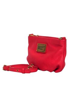 Made with a bright red leather, this textured treasure from Marc by Marc Jacobs is quite the knockout! Made with a mini silhouette, this is the perfect piece to wear with any casual outfit for some hands-free style and a splash of color. Pebbled leather Top zippered closure Adjustable crossbody strap One interior pocket Some discoloration from wear inside interior pocket Width 9.5" Height 6" Strap drop 25" Red Textured Leather Crossbody Shoulder Bag, French Girl Chic, Charity Work, Chic Shop, Buy Shoes Online, Free Style, Mini Crossbody Bag, Mini Crossbody, Marc By Marc Jacobs