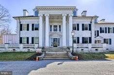 a large white house with columns and pillars