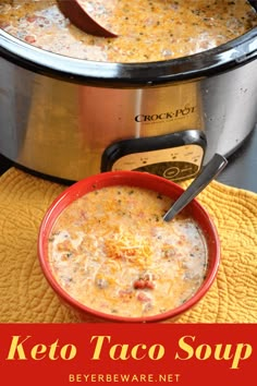 a bowl of keto taco soup next to a crock pot on a yellow towel