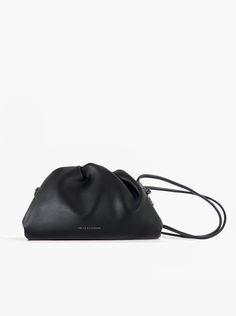 A classic day-to-night favorite from FREYA ESTEPHAN. Pouch handbag with shoulder strap * 100% genuine leather  * Mini: 22 cm wide x 5.5 cm deep x 13 cm high * Medium: 31 cm wide x 7 cm deep x 18 cm high  * Magnetic frame closure. Gold finish * Strap height: 53 cm NEW, with tags and box. Color: Black Black Leather Top Handle Pouch, Black Leather Pouch With Detachable Strap, Black Leather Pouch With Adjustable Strap, Black Soft Leather Crossbody Pouch, Black Leather Evening Pouch, Elegant Soft Leather Black Pouch, Elegant Black Soft Leather Pouch, Everyday Black Pouch With Detachable Strap, Magnetic Frame