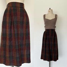 - Vintage 1980's era high waisted wool secretary style skirt - 100% pure wool medium weight textured woven fabric  - Vertical striped pattern (has a plaid look from afar) in brown, rust, purple, blue, and green - High waisted with single button closure at left side - Inside is fully lined with a brown nylon fabric - Two side hip pockets - A-line shape falls below-the-knee in length *Top in photo not included. SIZE: Label says 14, Fits like a Large, 31" waist LABEL: JH Collectibles, Ladies Garment Workers Union label, Made in USA MEASUREMENTS: Waist 31", Hips 49", Length 31" CONDITION: Overall great condition. no visible marks or flaws to note. **See the rest of my shop here: valleygirlphx.etsy.com Secretary Style, Workers Union, Garment Workers, Striped Skirt, Skirt Vintage, Style Skirt, Brown Plaid, Size Label, Nylon Fabric