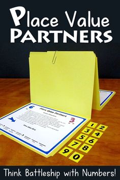 a yellow folder sitting on top of a wooden table next to a sheet of paper