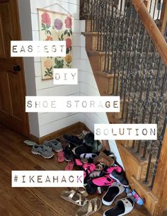 there are many pairs of shoes on the floor in front of the stairs and stair case