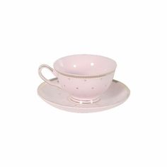 a pink tea cup and saucer with gold dots on the rim, set against a white background