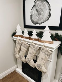 stockings hanging from the mantle in front of a fireplace