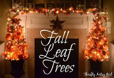 a decorated fireplace with fall leaf garland around it